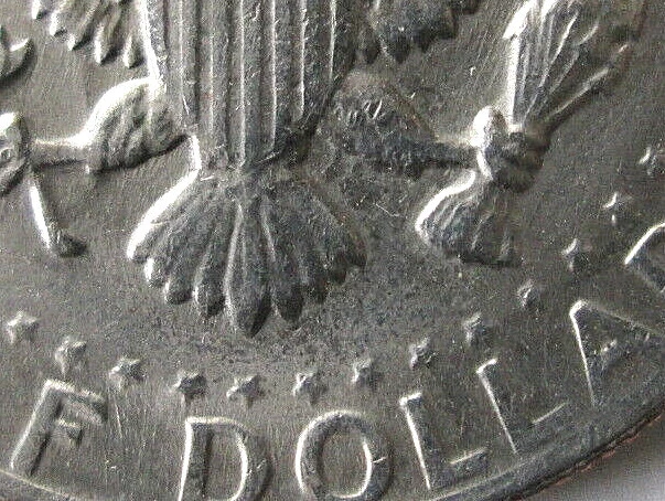 1983-P Kennedy Half Dollar reverse close-up showing missing No FG error where Frank Gasparro initials are absent